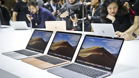 FILE - Apple shoppers