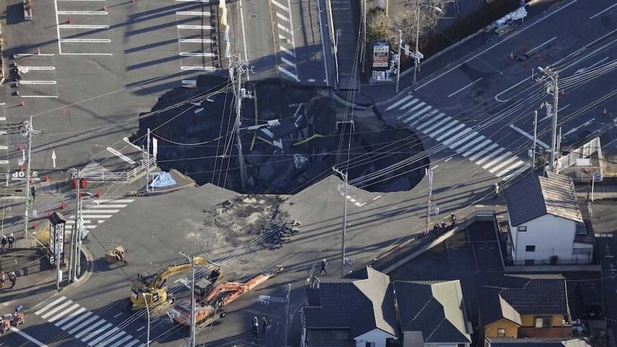 Rescuers in Japan struggle to save truck driver trapped in sinkhole for three days