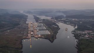A ship travels through Miraflores locks on the Panama Canal