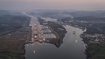 A ship travels through Miraflores locks on the Panama Canal