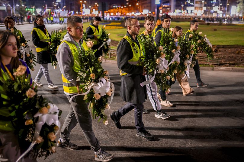 Protesters carry wreaths with the names of the Novi Sad train station victims, 31 January, 2025