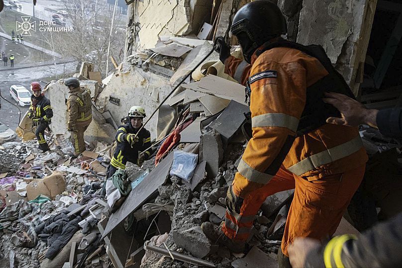 Rescuers search for civilians who were killed when a Russian drone hit an apartment building in Sumy, 30 January, 2025