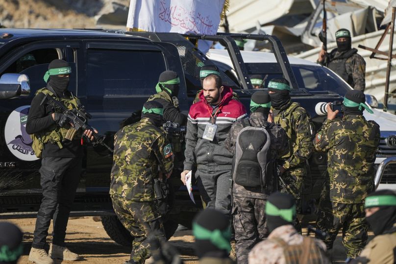 Israeli Yarden Bibas is escorted by Hamas fighters before being handed over to the Red Cross in Khan Younis, Feb 1st 2025