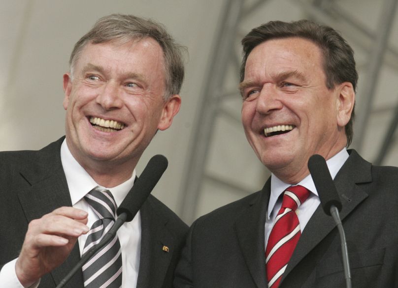 Presidente da República Federal Horst Köhler (esquerda) e o chanceler Gerhard Schröder na abertura do 30o Congresso. Dias da Igreja Protestante Alemã em Hanover, 25/05/2005