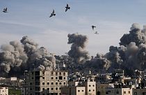 Smoke rises following an explosion detonated by the Israeli army, which said it was destroying buildings used by Palestinian militants in the West Bank Jenin refugee camp.