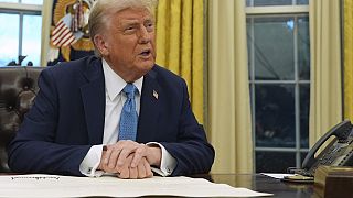 President Donald Trump speaks to reporters as he signs executive orders in the Oval Office of the White House, Friday, Jan. 31, 2025, in Washington.