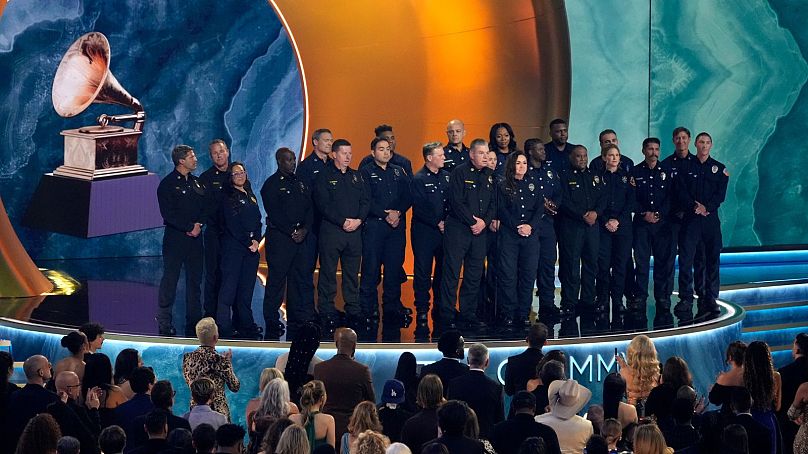 Members of the County of Los Angeles Fire Department present the award for album of the year during the 67th annual Grammy Awards 