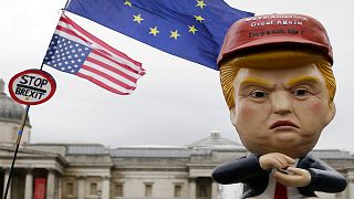 Large puppet portraying Donald Trump is carried as people gather in Trafalgar Square, central London, to demonstrate against the state visit of President Donald Trump.