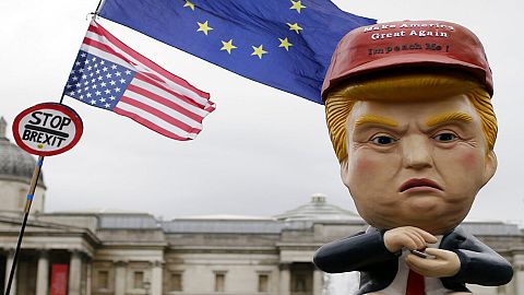 Large puppet portraying Donald Trump is carried as people gather in Trafalgar Square, central London, to demonstrate against the state visit of President Donald Trump.