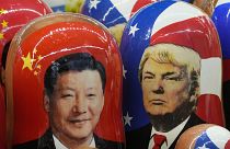 Traditional Matryoshka Russian wooden dolls on sale in Russia last year depict China's President Xi Jinping, left, and US President Donald Trump 