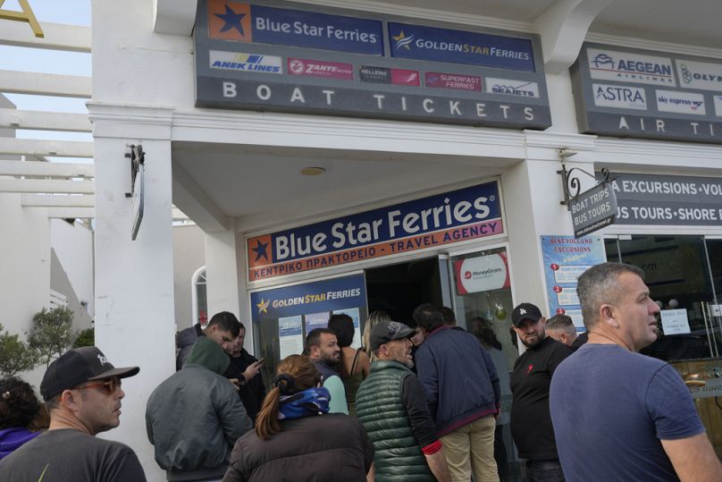 People wait to buy boat and air tickets as Greek authorities are taking emergency measures in response to intense seismic activity on the island of Santorini, Feb 2025.