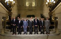 Belgium's King Philippe, center front, and new Belgian Prime Minister Bart De Wever, front center left, pose with ministers.