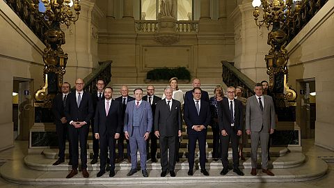 Belgium's King Philippe, center front, and new Belgian Prime Minister Bart De Wever, front center left, pose with ministers.