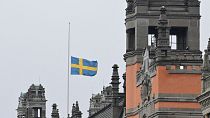 A Swedish flag flies at half-mast at Rosenbad, Sweden's Government Offices in Stockholm, Wednesday Feb. 5, 2025, after a shooting at an adult education center.