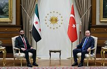 Turkish President Recep Tayyip Erdogan sits next to Syria's interim President Ahmad al-Sharaa during meeting at the presidential palace in Ankara, Turkey, Tuesday Feb. 4, 2025