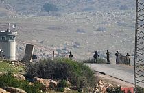 Israeli soldiers stand guard at a checkpoint where the military said an attacker fired at an army base near the village of Tayasir in the northern West Bank, Tuesday, Feb. 4, 