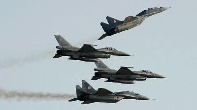 Two Russian-made Mig 2s (above) and two US-made F-16's fighter jets, all belonging to the Polish Air Force.