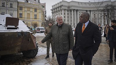 Britain's Foreign Secretary David Lammy looks at damage on a Russian APC, in central Kyiv, Ukraine, Wednesday, Feb. 5, 2025.