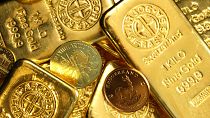 Gold bars and coins on display