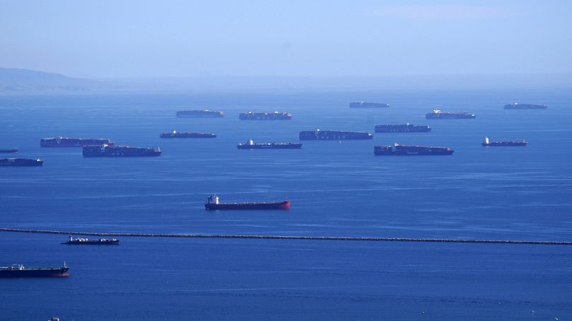 Cargo ships are seen lined up outside the Port of Los Angeles.