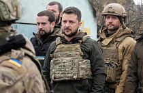 Ukrainian President Volodymyr Zelenskyy examines the site of a recent battle in Bucha, close to Kyiv, Ukraine, Monday, Apr. 4, 2022. 