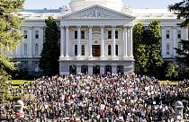Several hundred demonstrators rally against President Donald Trump outside the California State Capitol on Wednesday, Feb. 5, 2025, in Sacramento, Calif.