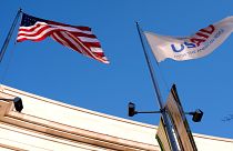 The US and USAID flags flying in Washington, DC.