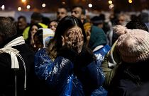 People gather to mark the two-year anniversary of the country's catastrophic earthquake