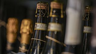 Bottles of Prosecco are lined up on a shelf of a wine shop in Rome, Thursday, Feb. 6, 2025. (AP Photo/Andrew Medichini)