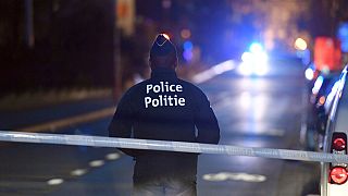 A police officer stands at a cordon during the investigation of a suspect car in the center of Brussels on Thursday, March 2, 2017.