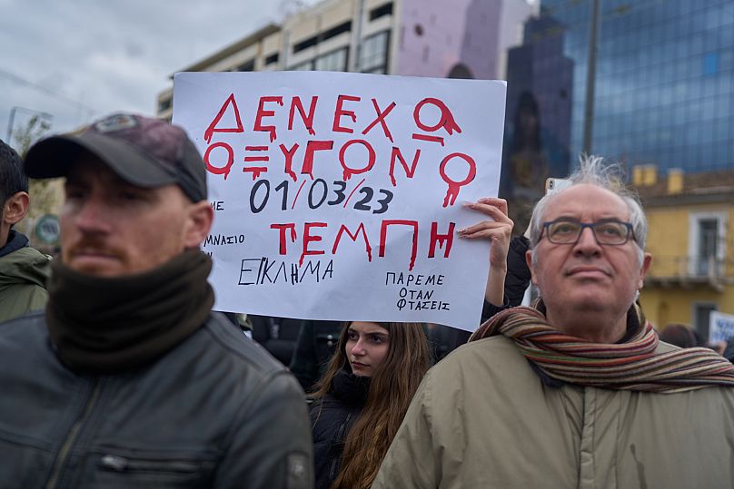 A student holds a placard saying ‘I have no oxygen’ during an anti-government protest in Athens, 7 February, 2025