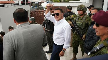 Ecuador's President Daniel Noboa waves outside a polling station in Quito on 9 February, 2025. 