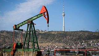 A pumpjack operates at a drilling site in Baku, Azerbaijan, September 2024.