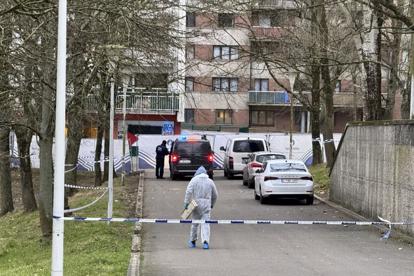 Police work in an area around an apartment complex after a shooting incident in Brussels, Friday, Feb. 7, 2025. (AP Photo/Sylvain Plazy)