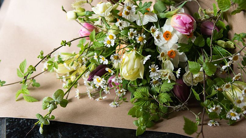 A bouquet of seasonal, locally-grown flowers, including native wildflowers are prepared on a farm in Yorkshire