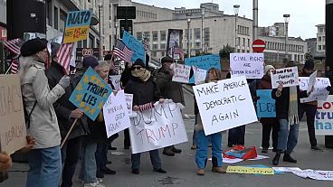 Demonstrators gathered in front of the Central Station in Brussels, Belgium to protest against US President Donald Trump's administration, Feb. 12, 2025.