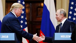 President Donald Trump shakes hands with President Vladimir Putin at the end of a news conference in Helsinki.