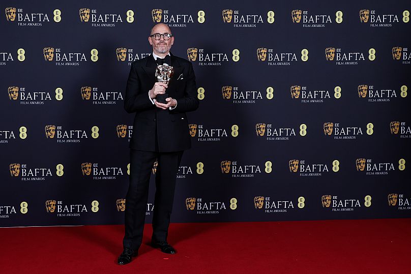 Edward Berger holds the Outstanding British Film award for Conclave at the 78th BAFTAs in London on 16 February 2025.