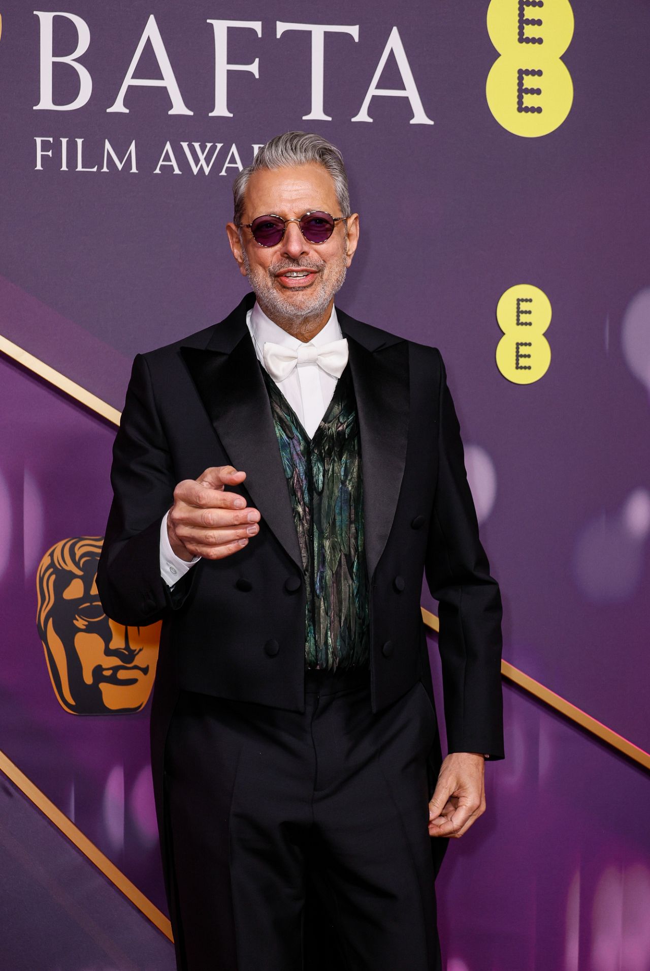 Wicked star Jeff Goldblum looked dapper in a tailcoat paired with a feather-embellished waistcoat and his signature shades.