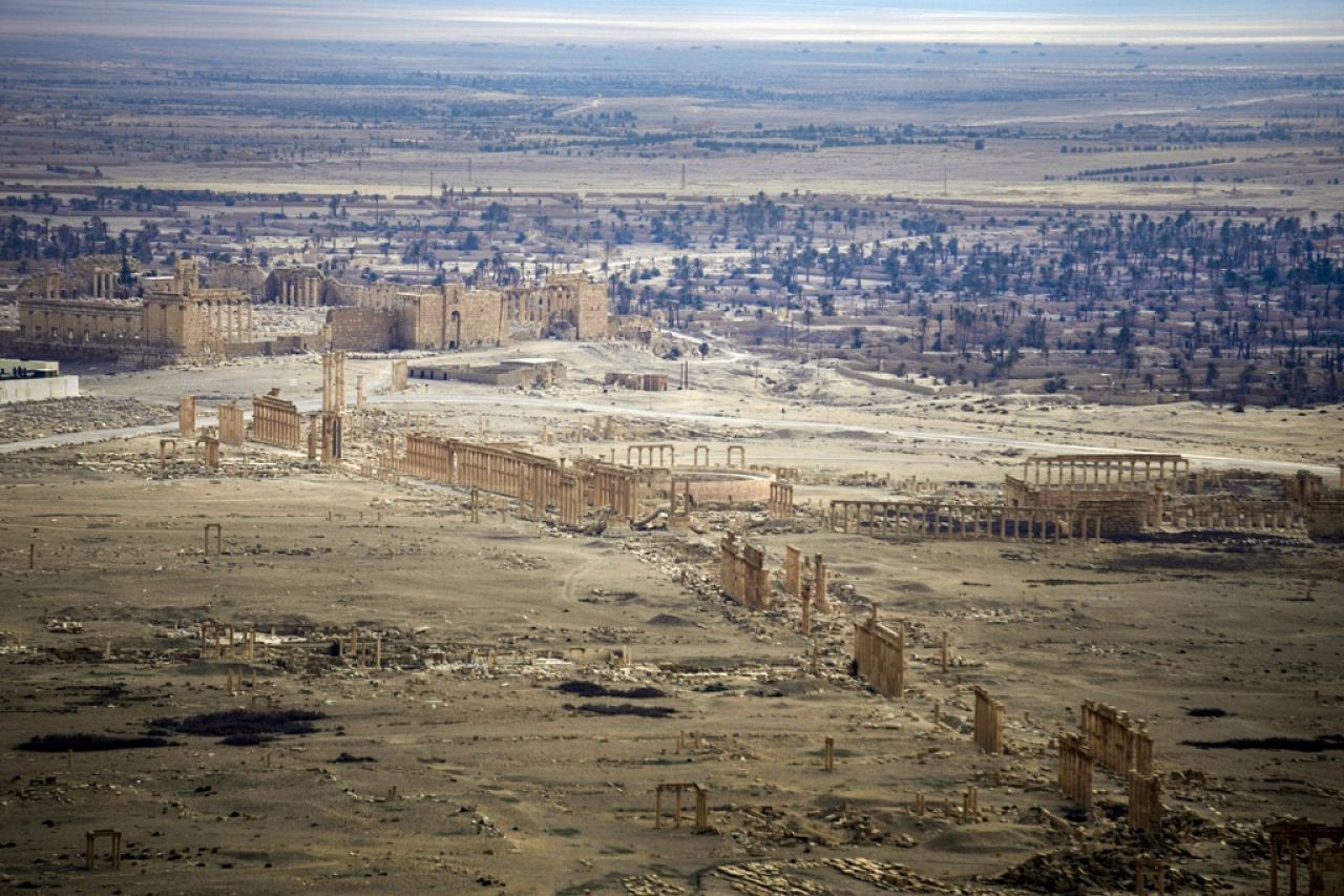 A high-angle view shows the ancient city of Palmyra, Syria.