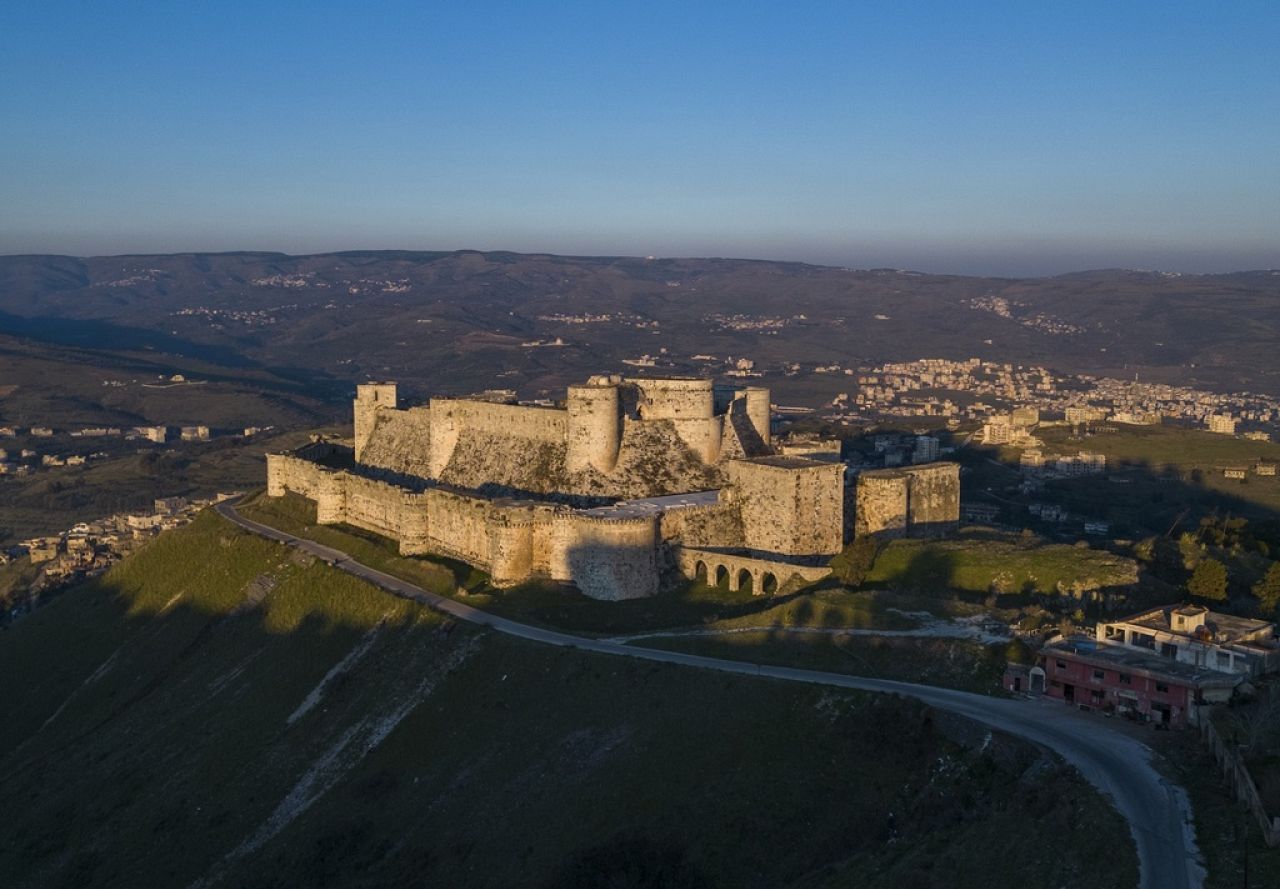 An aerial view shows the sun sets over Krak des Chevaliers on the outskirts of Homs, Syria.