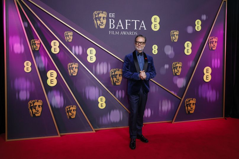 Guy Pearce poses for photographers upon arrival at the 78th British Academy Film Awards, BAFTA's, in London, Sunday, Feb. 16, 2025.