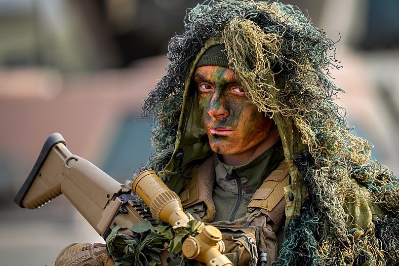 A French paratrooper stands at the end of the Steadfast Dart 2025 exercise in eastern Romania, 19 February, 2025