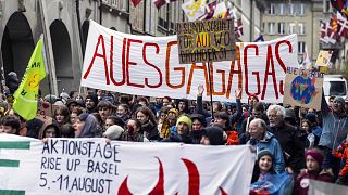 Activists gather on the occasion of the global climate strike day, Friday, 19 April 2024, in Bern, Switzerland.