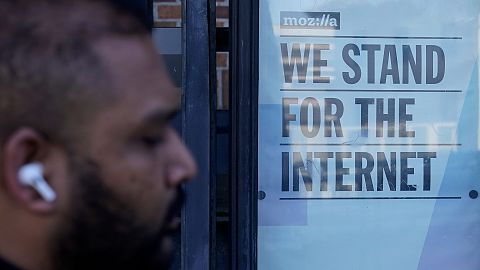 A pedestrian walks past a sign outside of a Mozilla office in San Francisco, Wednesday, April 12, 2023.