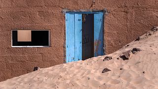 An abandoned house sits in sand near Chinguetti, Mauritania.