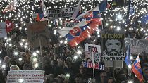 People gather to mark the seventh anniversary of the slayings of an investigative journalist and his fiancee, Jan Kuciak and Martina Kusnirova, Bratislava, Friday Feb 21, 2025