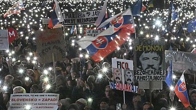 People gather to mark the seventh anniversary of the slayings of an investigative journalist and his fiancee, Jan Kuciak and Martina Kusnirova, Bratislava, Friday Feb 21, 2025