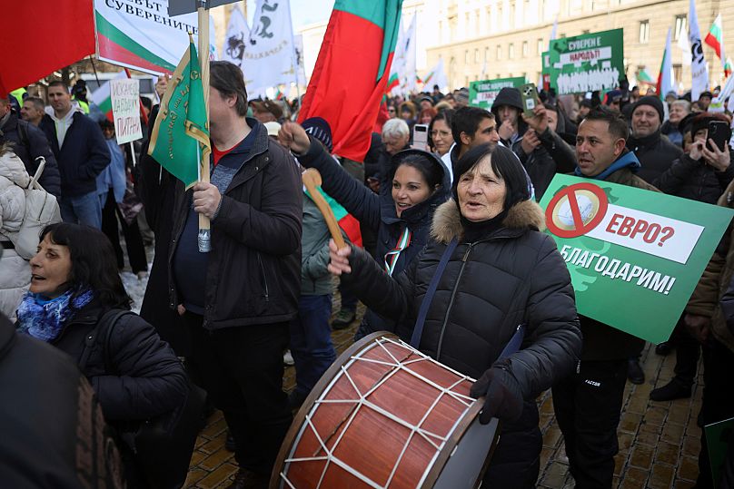 Protesters shout anti-government slogans during protests demanding the government scrap plans to take the country into the eurozone, 22 February, 2025