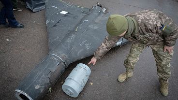 FILE: A Ukrainian officer shows a thermobaric charge of a downed Shahed drone launched by Russia in an undisclosed location in Ukraine, 14 November 2024